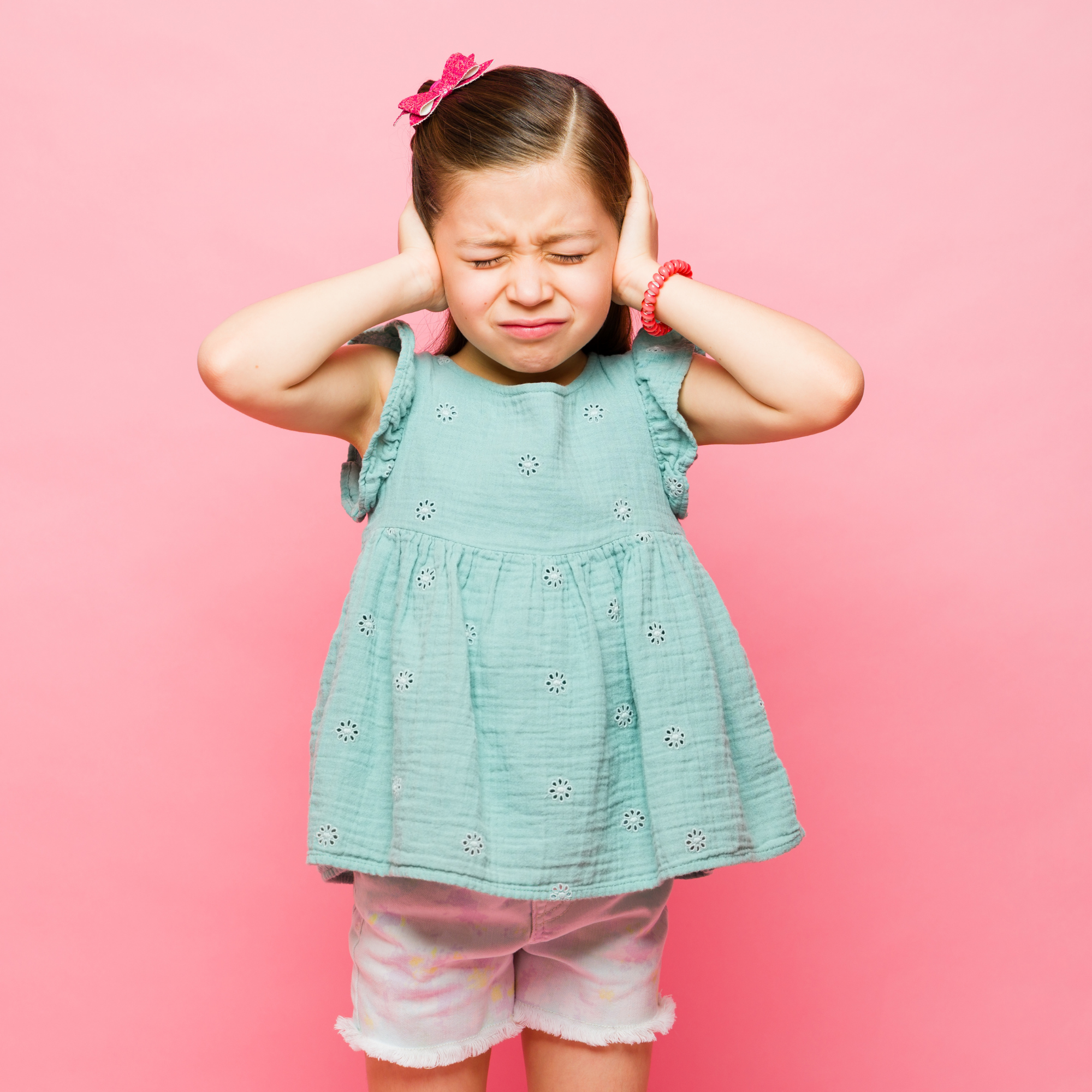 Children exploring an outdoor educational sign together in a park
